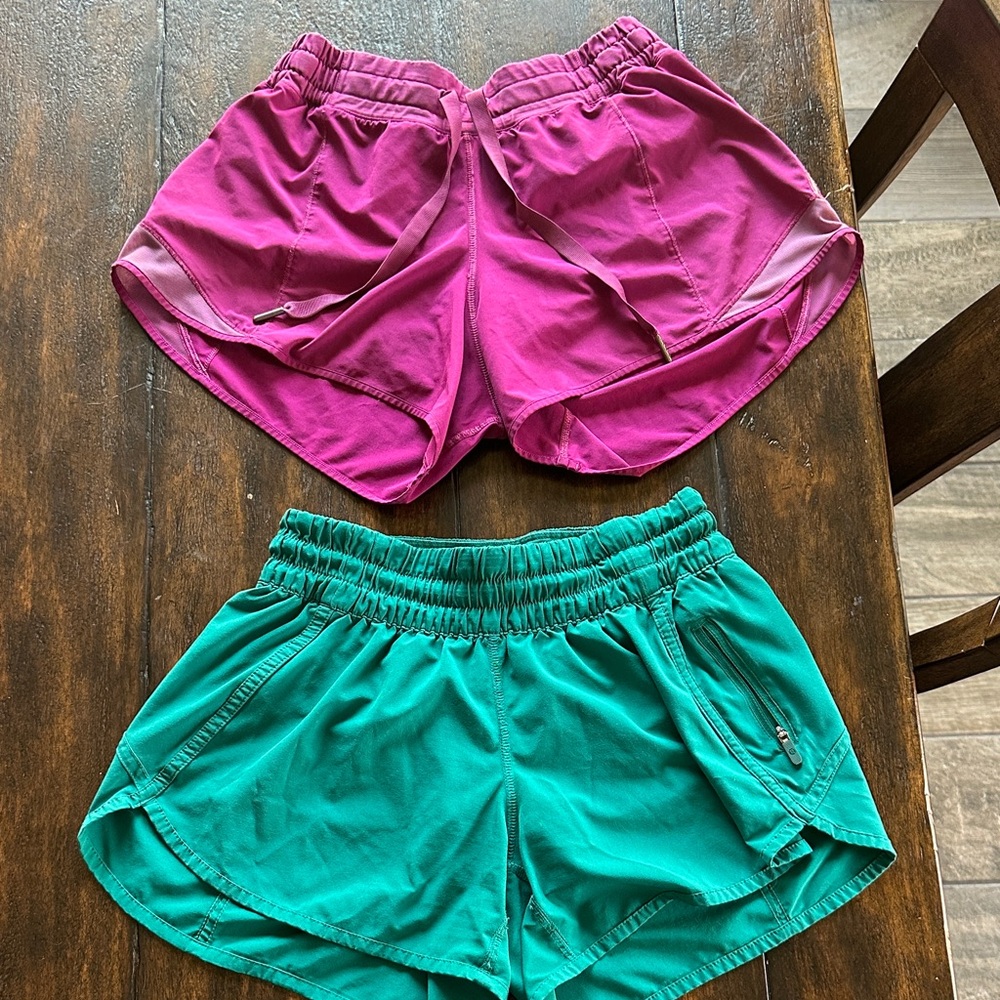 Two pairs of Lululemon hotty hot shorts Shorts in Magenta and Teal size 6